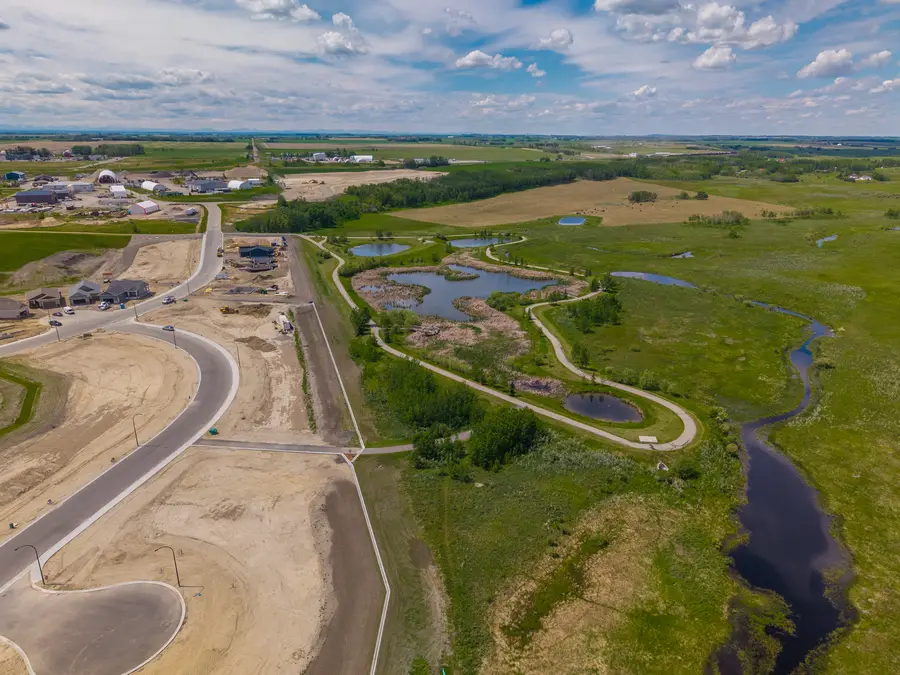 Valarosa streets and ponds under a big Alberta sky