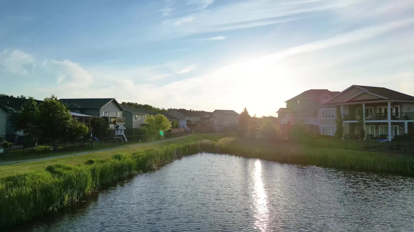 Pond at golden hour beside Valarosa homes